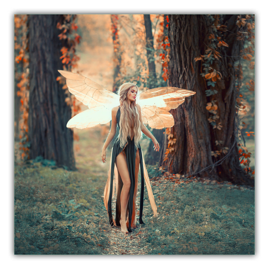 Autumn Light Fairy. Woodland background with trees and leaves in orange and brown colours. Fairy with wings outstretched with long blonde hair wearing and a green and orange dress with bare legs and feet waking on a grassy path.